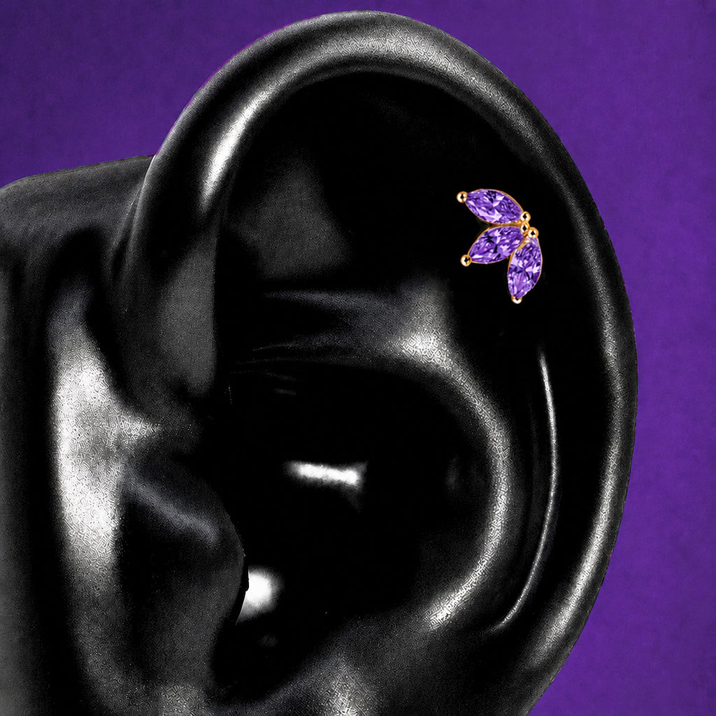IMBER Bloom Helix/Conch Purple marquise stud in gold with purple stones, on ear display
