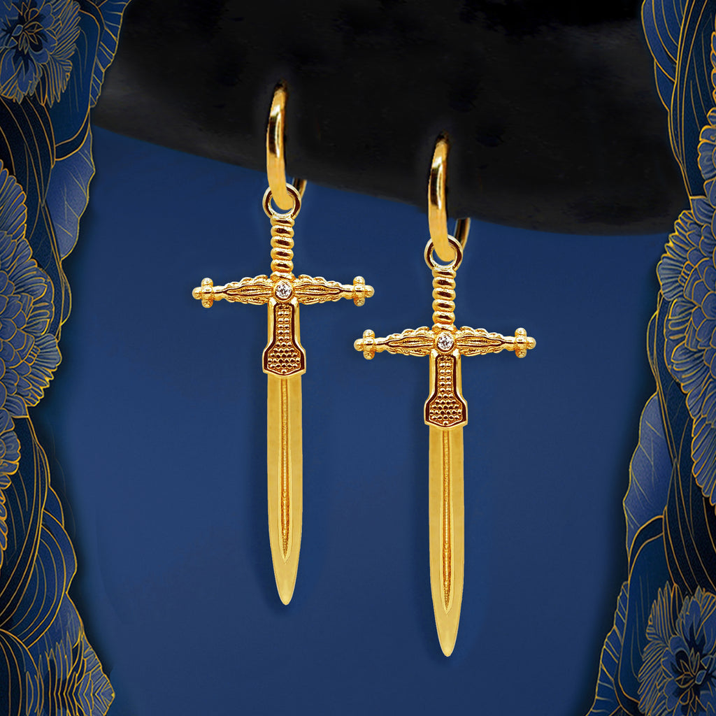 Gold sword earrings with dagger-inspired pendants – bold statement earrings for an edgy yet elegant look