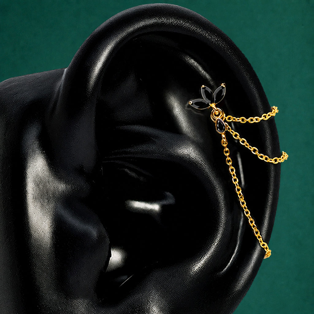 IMBER Eternal black and gold waterproof floral helix earring with marquise-cut black stones, flat back stud closure, and draping chain details for a curated ear stack.
