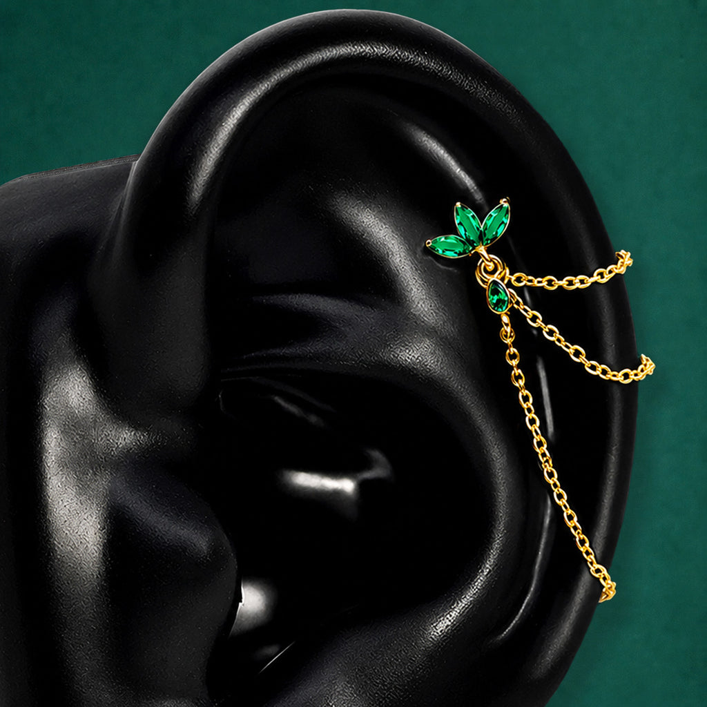 IMBER Eternal green floral helix earring in gold with marquise-cut green stones and three draping chains shown on a black ear display
