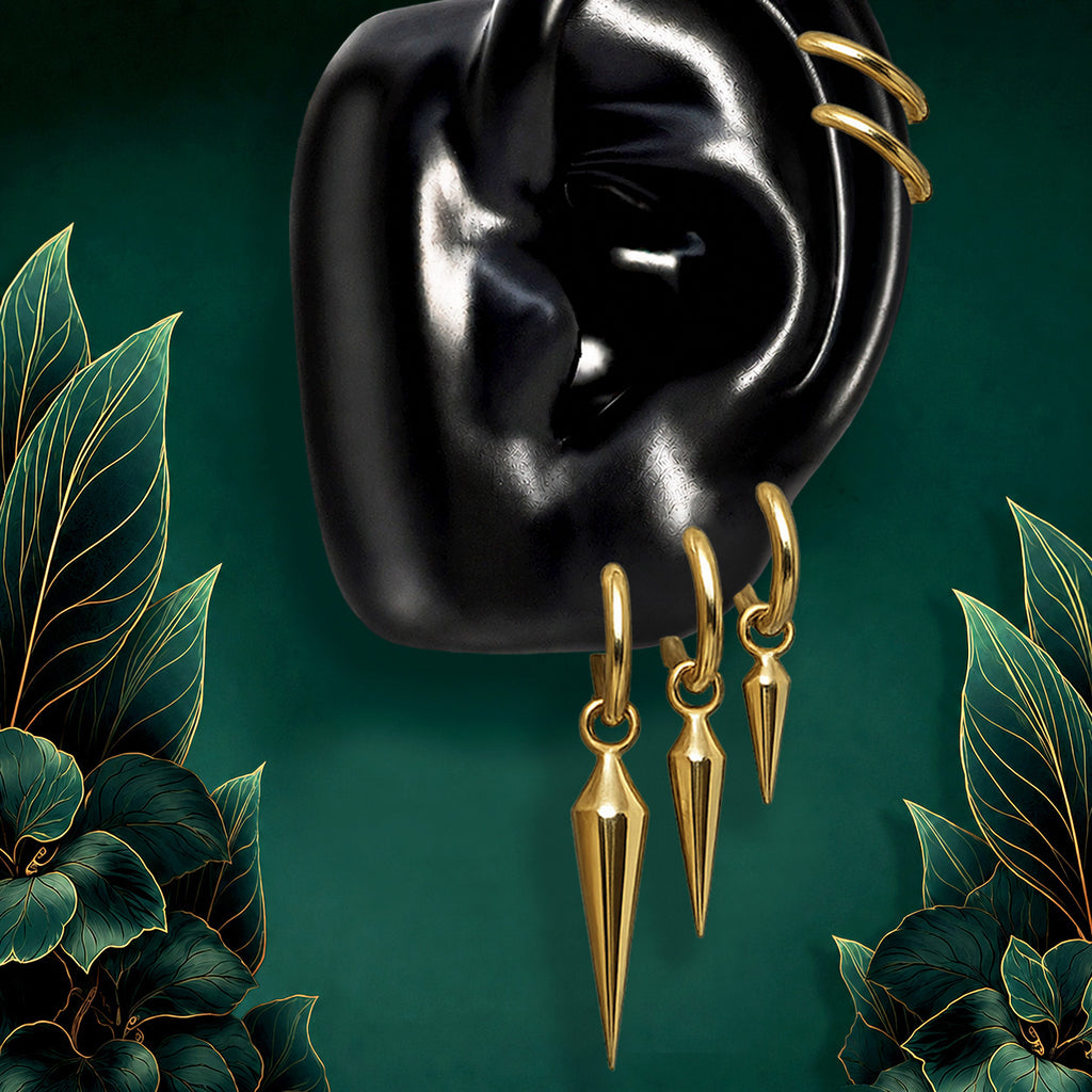IMBER Zenith gold waterproof earring stack with implant grade titanium spike huggies and dangling spike charms for a bold curated ear stack