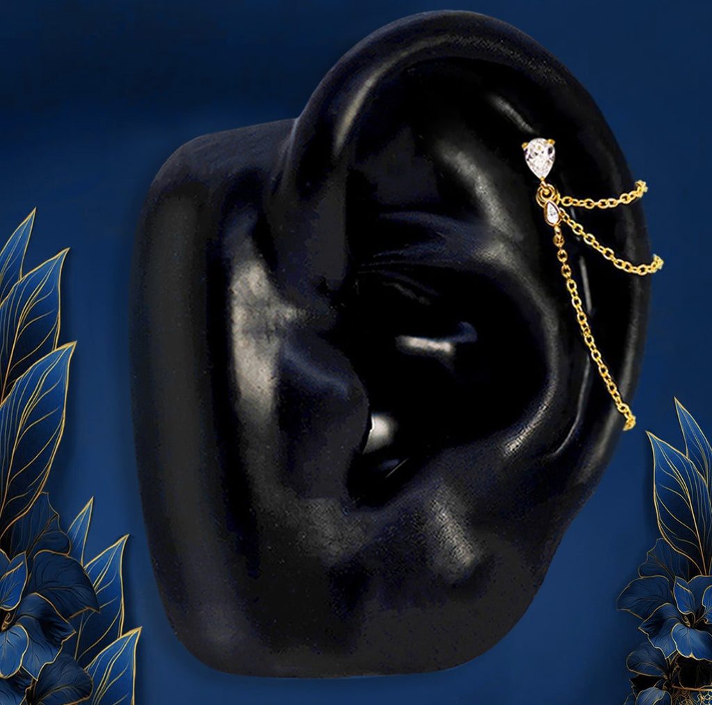 IMBER Nocturne Helix flat back stud in gold sterling silver with draped chains, on display